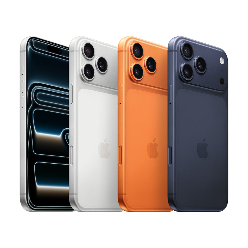 A lineup of four iPhone 17 Pro Max units displayed together, showing the front display on the left and three different color finishes on the rear: Silver, Orange, and Dark Blue.